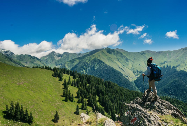Adventurous Solo Backpacker Hiking in Mountain Wilderness